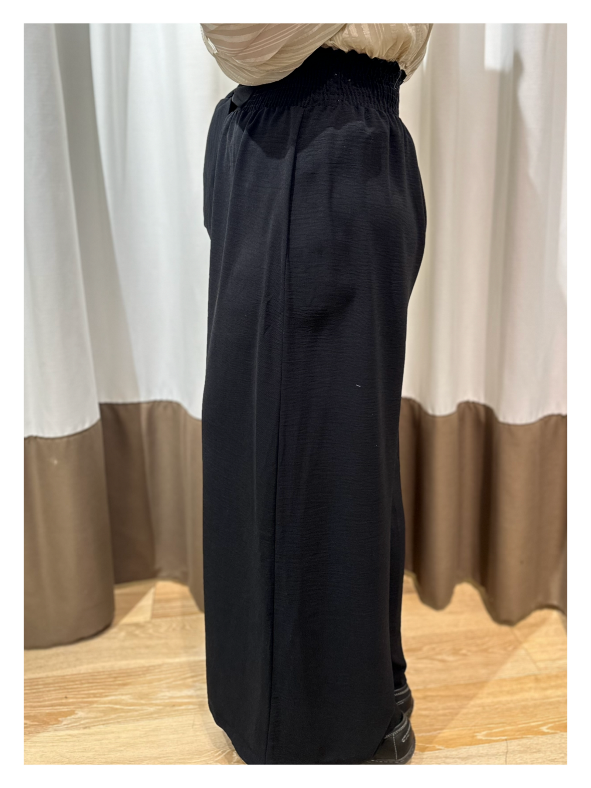 side view of black palazzo style pants